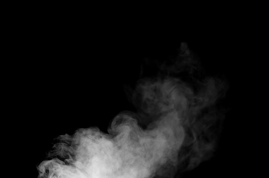 White smoke or fog isolated on black background for design elements, abstract texture, vapor effect, and atmospheric background for creative or cinematic use
