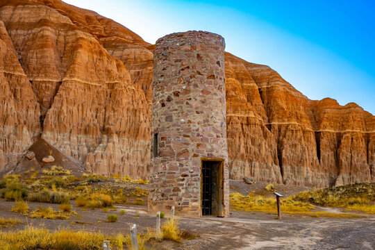 Historic water tower nestled among Cathedral Gorge formations
