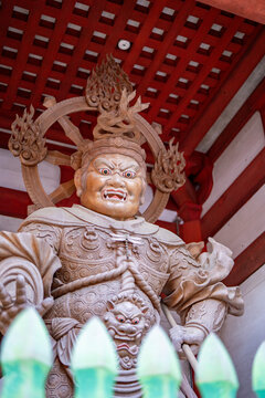 Wooden Nio guardian deity sculpture inside protective temple structure at Mount Rokko Kobe Japan