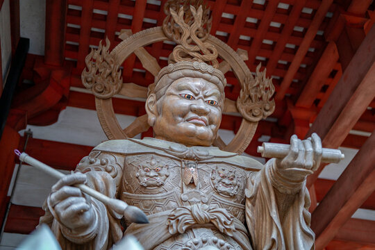 Close up of fierce wooden Nio temple guardian statue protecting shrine at Mount Rokko Kobe Japan