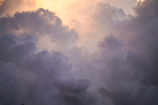 Dramatic Storm Clouds with Sunlight Breaking Through at Sunset, Atmospheric Environment Concept