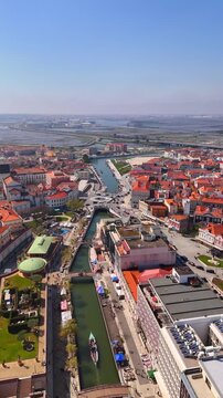 Moliceiro boat cruising along aveiro canal in portugal