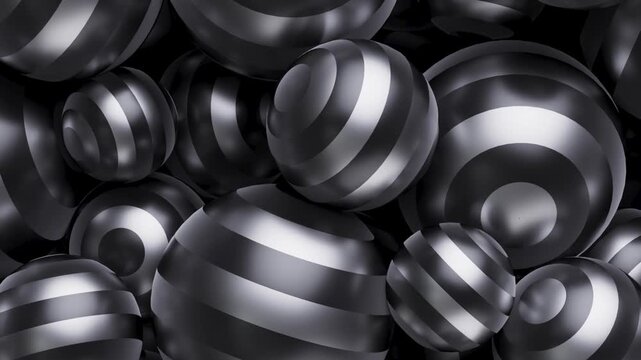 Hypnotic moving patterns wrapped around floating spheres. A cluster of shiny, striped spheres fills the frame, creating a dynamic and textured visual pattern.