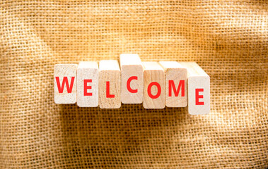 Welcome word symbol. Concept word Welcome on beautiful wooden blocks. Beautiful canvas background. Business welcome word concept. Copy space. © Dzmitry