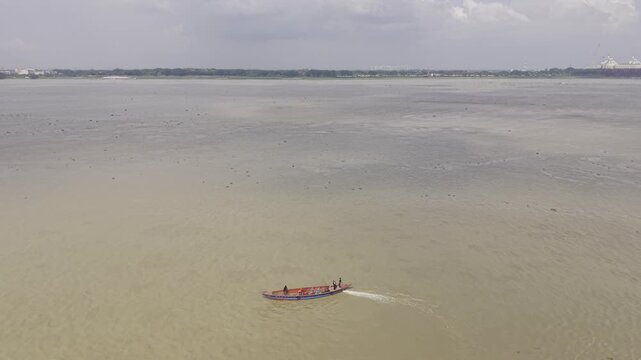 Aerial View of a Wooden Boat Traveling on the Wide Padma River in Bangladesh