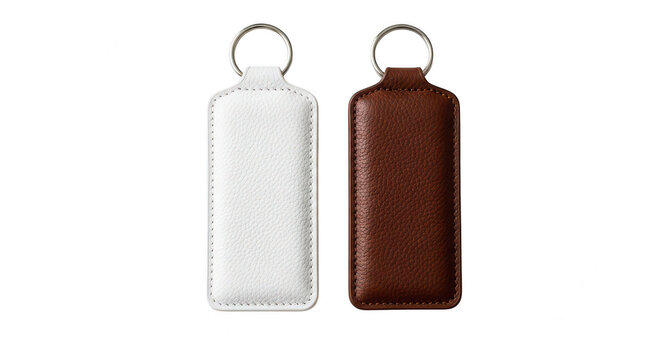 White and brown leather keychains with metal rings isolated on transparent background