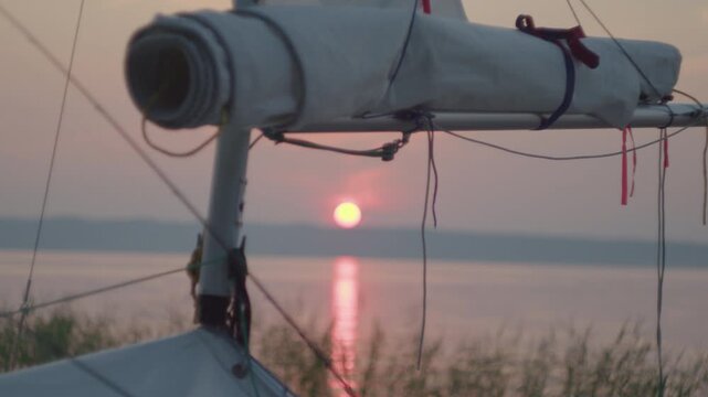 Sailing boat on the lake. Focus moves from the sail to the horizon