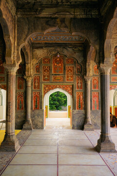 View of the intricate floral frescoes and stone arches inside the historic Jamia Mosque in Chiniot, Punjab, Pakistan.
