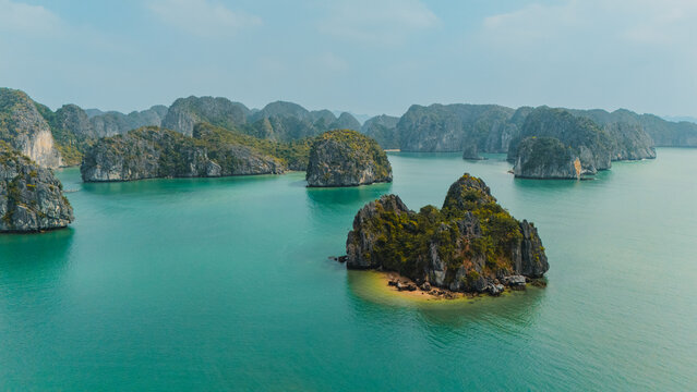 Limestone islets in emerald water at Ha Long Bay, Vietnam