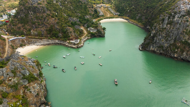 Aerial view of Ha Long Bay limestone cove and boats
