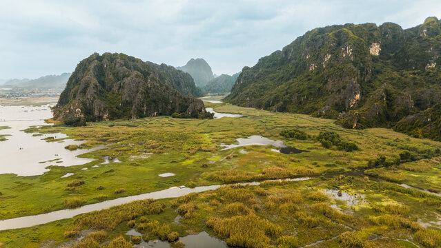 Aerial view of karst wetlands and limestone mountains in Vietnam