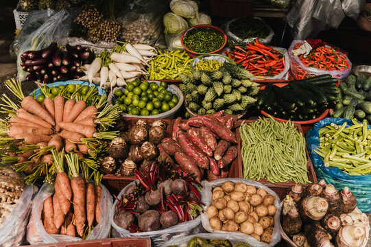 Traditional Vietnamese market with fresh tropical vegetables