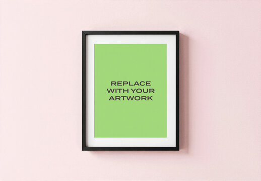 Framed vertical poster mockup displayed on a light pink wall, featuring black frame, white mat, and placeholder text, realistic art presentation for graphic design, print