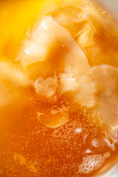 Homemade kombucha tea with scoby and bubbles in jar
