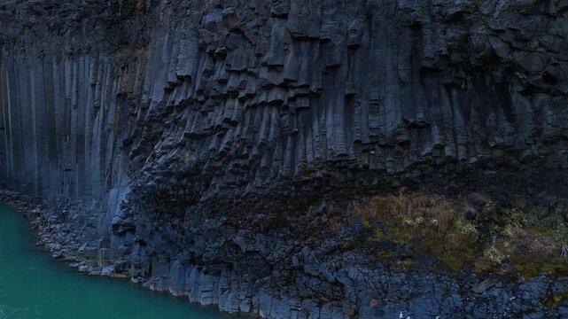 Close up aerial view of intricate basalt column wall texture at Stu&eth;lagil canyon Iceland