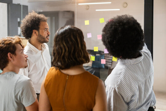 Diverse team collaborate during coworking office brainstorming