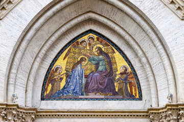 Fototapeta premium The Coronation of the Virgin Mary – mosaic on the pediment of Santa Maria del Rosario Church in Rome, Italy.