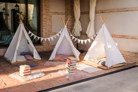 Cozy teepee play area with cushions and games