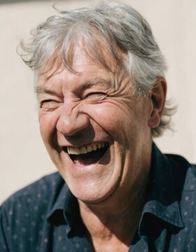 Elderly man experiencing true happiness and joy while embracing life and cherishing everyday moments that reflect the essence of an older adult's lifestyle