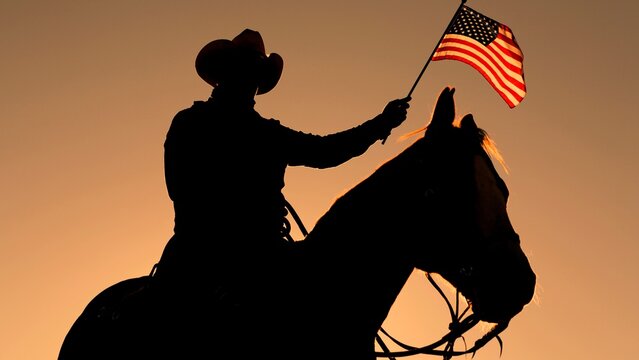 Western Cowboy Celebrating Freedom with American Flag
