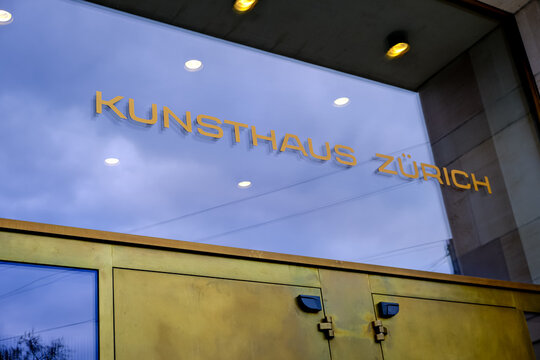 Zurich, Switzerland - March 15, 2026. Golden Kunsthaus Z&uuml;rich Museum Sign on Glass Facade Entrance. A low-angle shot captures the iconic golden lettering of the Kunsthaus Z&uuml;rich art museum mounted on 
