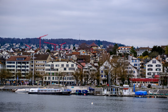 Zurich, Switzerland - March 15, 2026. Scenic Waterfront View of Zurich Harbor on Lake Zurich. A beautiful wide-angle view across the calm waters of the harbor where the Limmat River meets Lake Zurich 