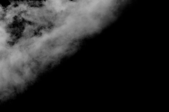 Realistic smoke effect drifting and spreading in freeze motion against a black background. Cinematic atmospheric fog ideal for VFX compositing, overlays, transitions, and moody visual effects.