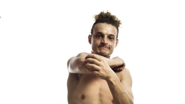 Shirtless Man Scratching Elbow Due to Itchy Skin on White Background