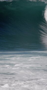 Crashing powerful ocean wave in ocean. Slow motion