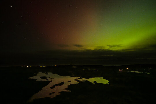 The Aurora Borealis, the northern lights, showing up above Ringfort in County Donegal, Ireland