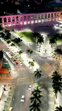 Lapa Arches In Rio De Janeiro Brazil. Capturing The Hustle And Bustle Of A Vibrant City From Above. Night Illuminated Skyline. Downtown Cityscape. Rio de Janeiro Brazil.