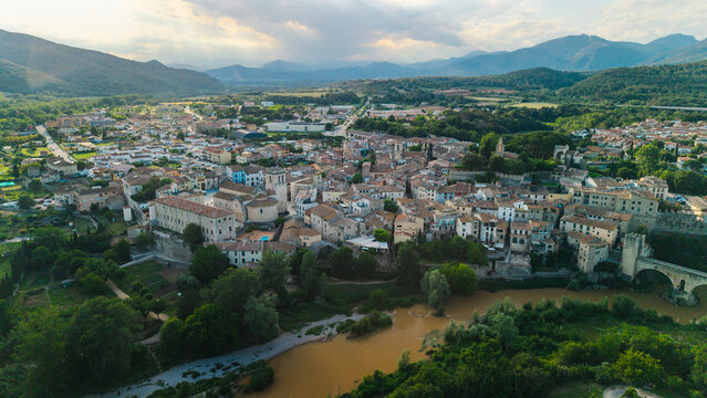 Aerial view of Besalu medieval town and stone bridge in Catalonia Spain at sunset