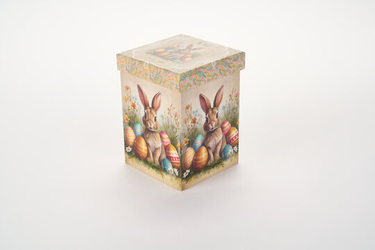 Square easter gift box decorated with cute rabbits and colorful painted eggs for the spring holiday