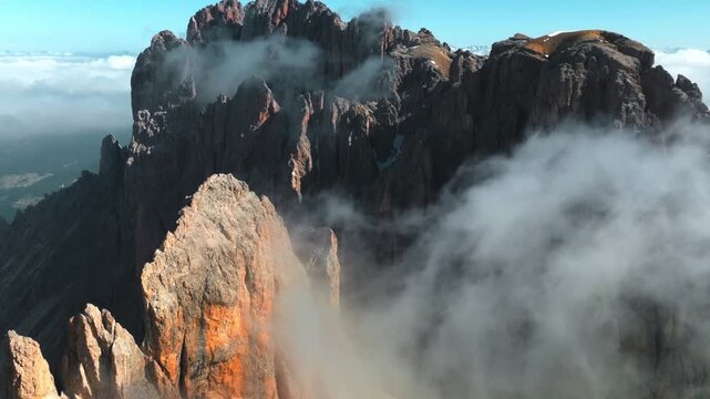 Dramatic volcanic eruption with thick smoke and ash cloud rising from rugged mountain .