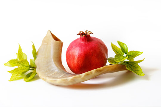 Shofar, pomegranate and pomegranate seeds. Rosh Hashanah (Jewish New Year holiday) concept.