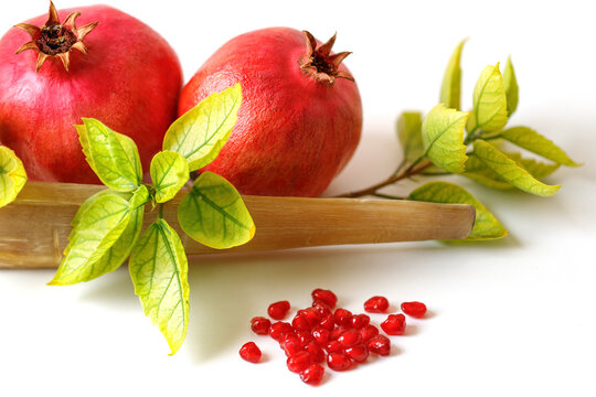 Shofar, pomegranate and pomegranate seeds. Rosh Hashanah (Jewish New Year holiday) concept.