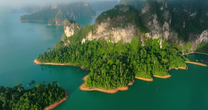 Cheow Lan Lake Surrounded by Morning Fog and Golden Light | Khao Sok National Park Thailand Drone View