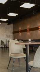Fotobehang Horeca Modern cafe interior with comfortable seating and ambient lighting  © shine.graphics
