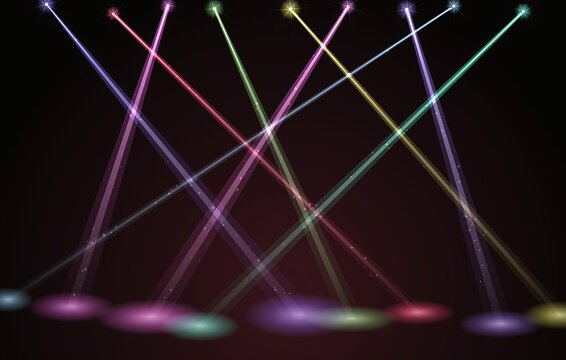 Colorful stage spotlights beams on dark background for concert and event lighting design
