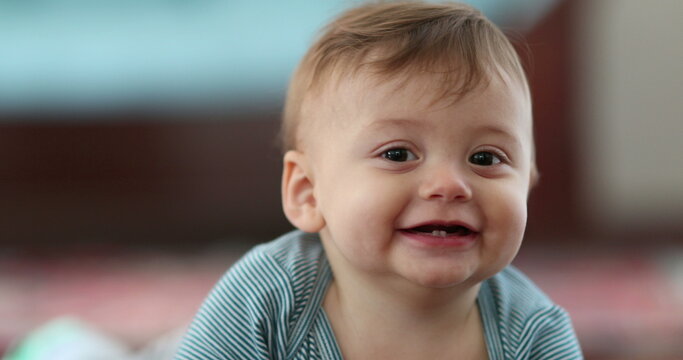 Bashful cute baby infant smiling