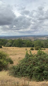 Panoramic view of rolling hills and rural valley from Cotswold Way trail