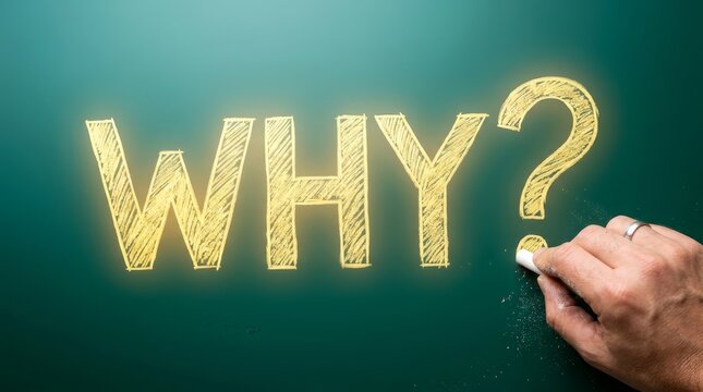A hand writing the question WHY? in yellow on a chalkboard to signify the search for answers.