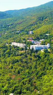 Vertical video. Livadia, Crimea. Livadia Palace - located on the shores of the Black Sea in the village of Livadia in the Yalta region of Crimea. Drone footage. Rich colors