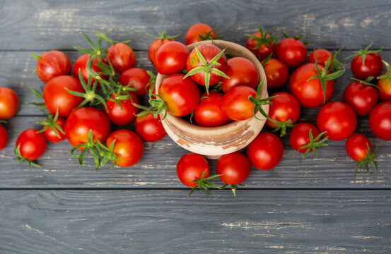 Fresh tomatoes vegetables, Fresh Harvest Ripe red farm organic cherry tomato on dark old background	