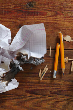 Crumpled Burning Paper Broken Pencils
