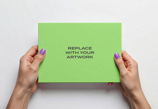 Rectangular box packaging mockup held by hands with purple nail polish, top-down view on white surface, flat lay presentation, graphic design template for branding, product display, stationery