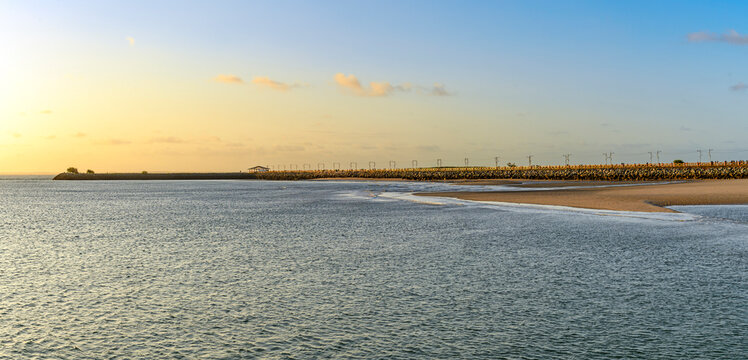 Sunset on the boardwalk extending into the sea in the Ponta de Areia neighborhood of S&atilde;o Lu&iacute;s.
