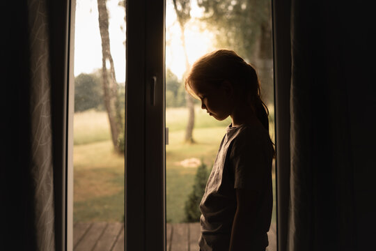 Sad little girl at home. 