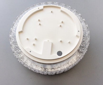 White Round LED Ceiling Light Fixture Underside on Grey Background