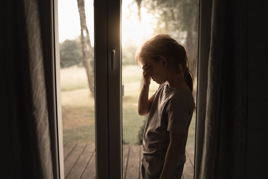 Sad little girl at home 